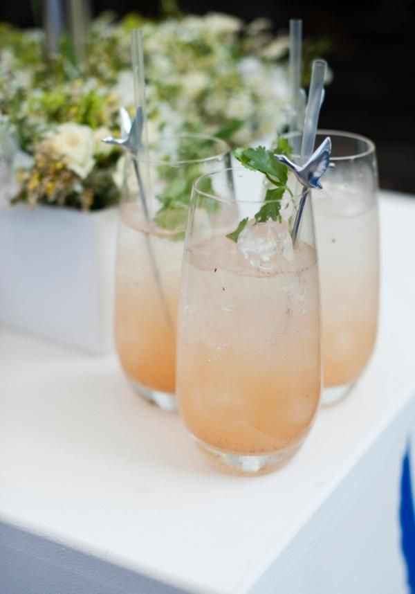 Three glasses of apricot-coloured cocktails
