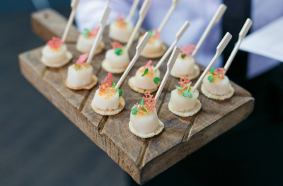 Small canapés on a wooden board