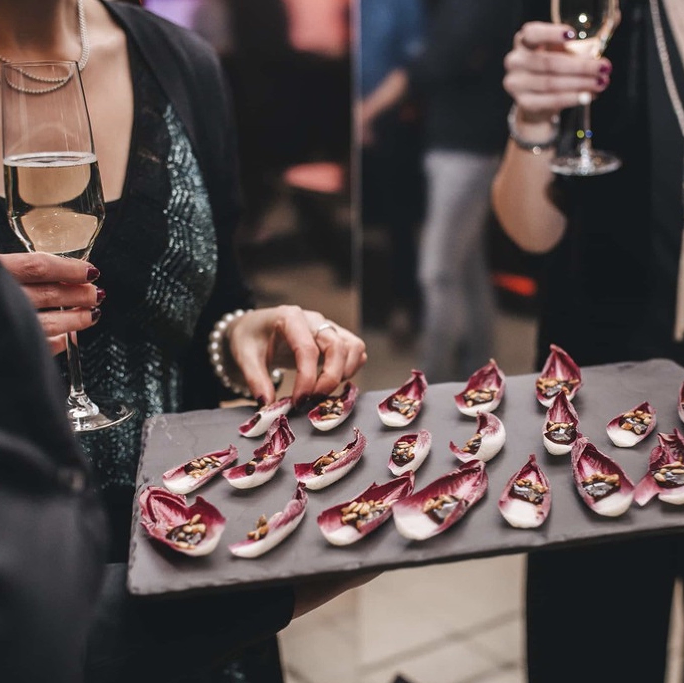 Guest taking food from a finger food platter