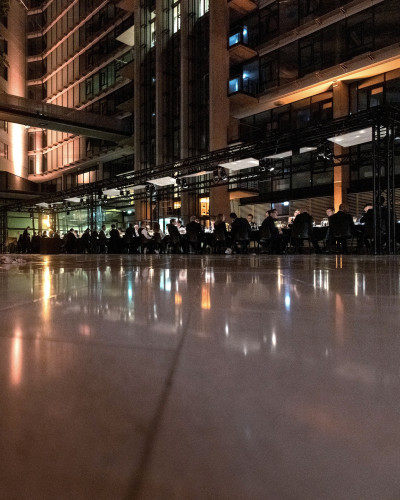 Long dinner table in the foyer of the Prisma building